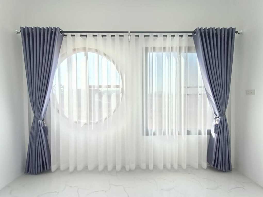Custom eyelet drapes fitted on windows