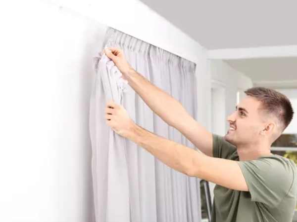 Expert curtain fixing in Dubai home