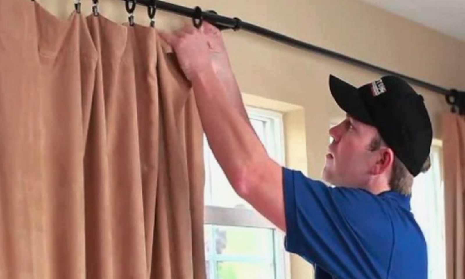 Precise silk drape installation on large windows